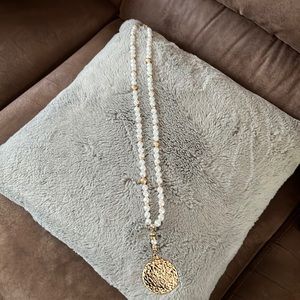 Faux white pearl long necklace with large gold medallion